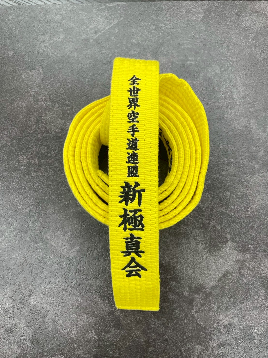 武道チームの帯への刺繍